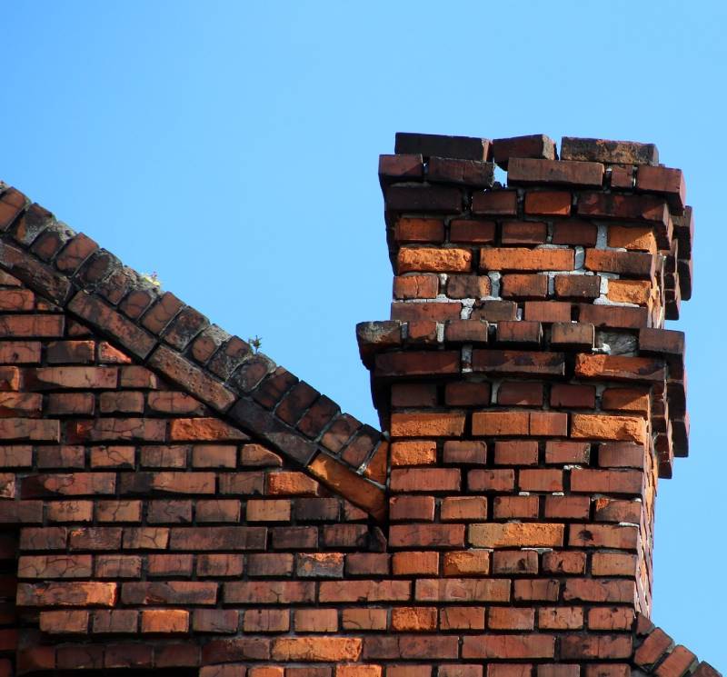 Signs Your Hamburg Home Needs a Chimney Inspection Damaged chimney on an Hamburg home showing cracks and missing mortar